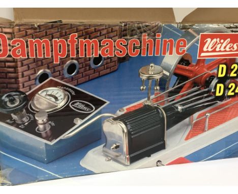 A boxed Wilesco static steam engine with control box.