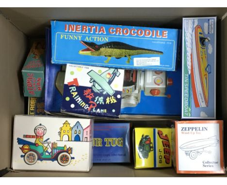 A box containing various reproduction boxed tin plate toys including a battery operated Space Walk Man, an Airship, Speedboat