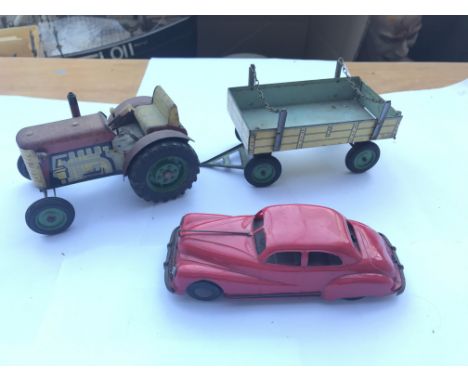 A tri-ang clockwork car,tractor and trailer.
