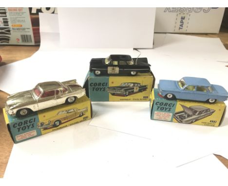 A Corgi Toys Studebaker "golden hawk"#2115, a Corgi toys Chevrolet#223"state patrol" and a Chevrolet#229, all boxed.(3)