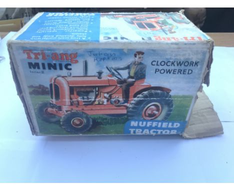 A Tri-ang Minic boxed clockwork Tractor.