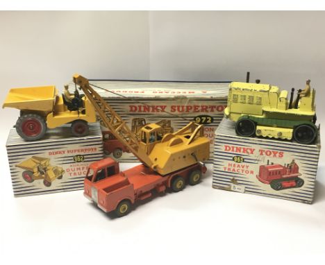 Three boxed Dinky Toys diecast maintenance vehicles, including a 20 Ton Lorry Mounted Crane Coles no. 972, Heavy Tractor no. 