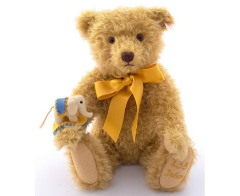 Steiff 135 Year Jubilee teddy bear, white tag 034046, LE 130/1880, 2015, mohair, he holds a felt elephant with a colourful sa