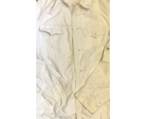AN OFFICER'S TROPICAL UNIFORM A white drill patrol jacket, edged all round with white flat braid, 7/8 in. wide, traced with w
