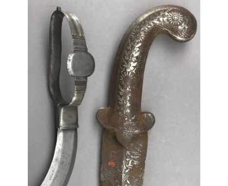 **AN INDIAN DAGGER (BICHWA) AND A JAMBIYA, LATE 19TH/EARLY 20TH CENTURY the first with recurved double-edged blade, and chara