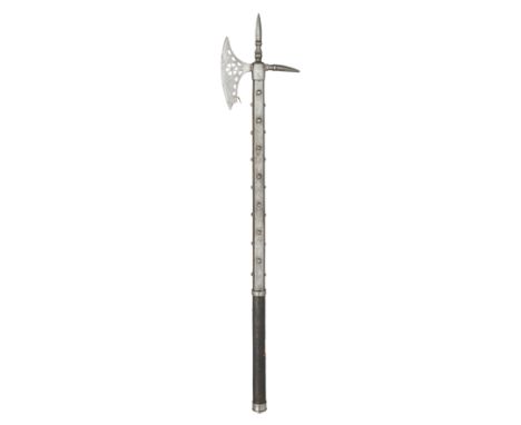 **A HORSEMAN'S AXE, POSSIBLY LATE 16TH CENTURY with curved axe-blade pierced with a central segmented circle in the centre an
