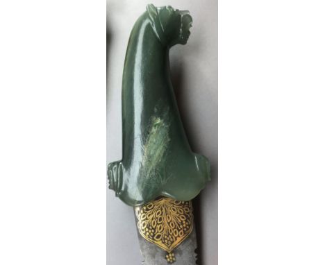 AN INDIAN JADE-HILTED DAGGER AND A TORAH POINTER, 20TH CENTURY the first with curved blade formed with a serrated edge and bi