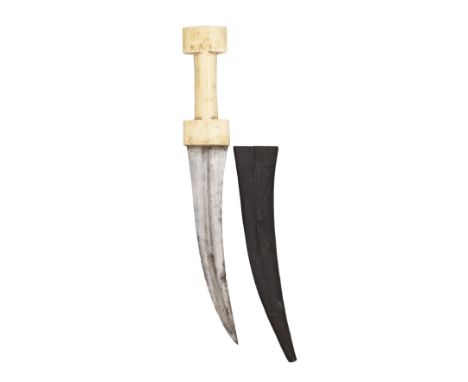 ˜AN OTTOMAN BALKAN DAGGER (JAMBIYA), 19TH CENTURY with curved blade formed with a medial ridge, marine ivory grip formed with