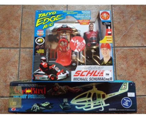 A Michael Schumacher action figure and kart, radio controlled, mint in presentation box and a VertiBird Night Patrol, glows i