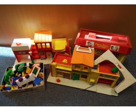 A good mixed lot of Fisher Price Play Family toys to include hospital, theatre, fire house, police station and garage with as