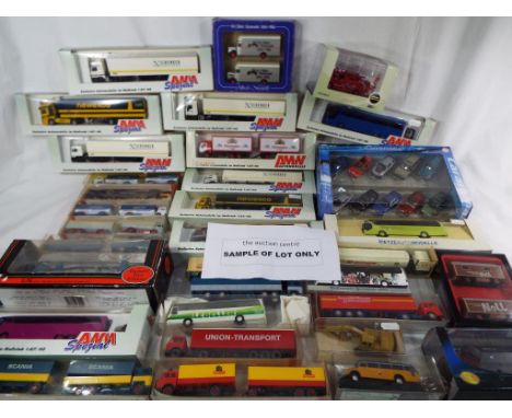 Ten Amw Spezial lorries all appear mint in box, a Cararama model diecast 1:72 scale vehicles on a plinth all VW related and a