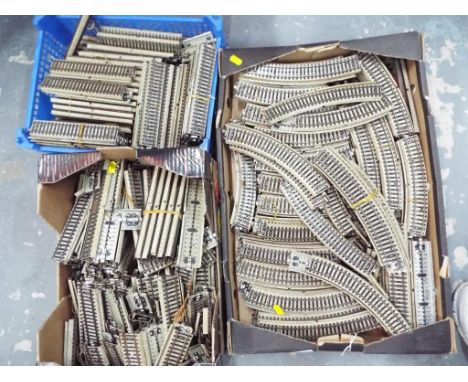 Model Railways - three boxes containing a large quantity of metal OO gauge track marked Marklin 51093/15, Germany (3)