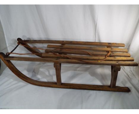 A vintage wooden sled