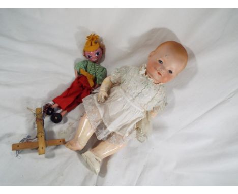 Dolls - a German Armand Marseille marked to the back of the neck 341/4K with sleeping glass eyes and closed mouth and a Pelha