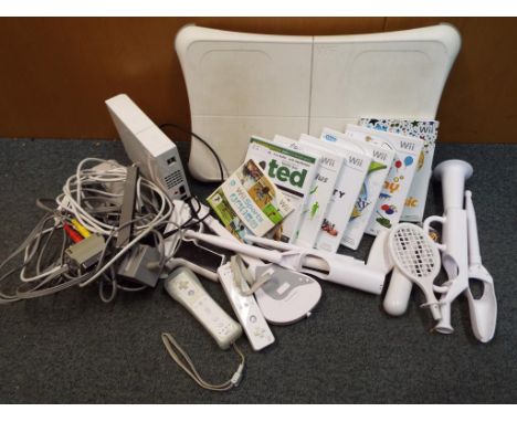 A Nintendo Wii Fit exercise platform with,console, games and accessories