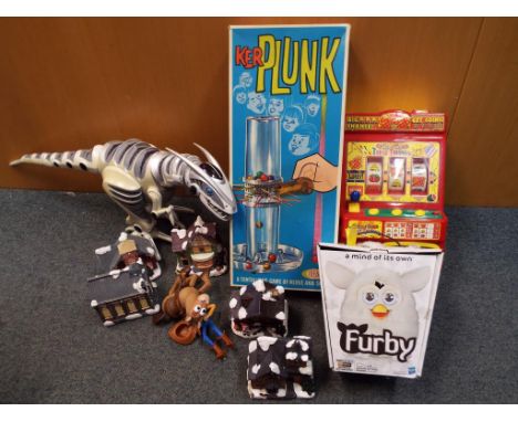 A good mixed lot to include Kerplunk game, slot machine, robot dinosaur, Toy Story models and a white Furby