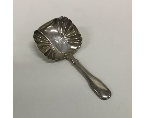 A Georgian silver fiddle pattern caddy spoon. London. By FM. Approx. 7 grams. Est. £10 - £15.