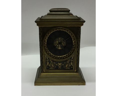 A good brass mantle clock attractively decorated with flowers and leaves to silvered dial. Est. £120 - £150.