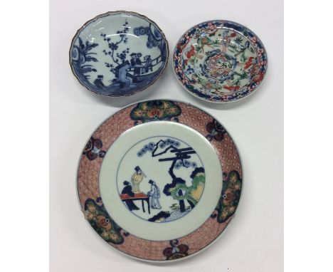 A blue and white Nanking saucer dish together with two other Chinese dishes. Est. £30 - £50.