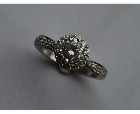 A good large diamond cocktail ring, the central stone in 18 carat claw mount. Approx. 6.3 grams. Est. £1300 - £1500.