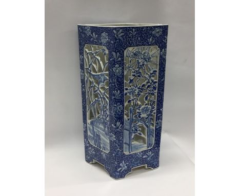 A tall Japanese blue and white stick stand with pierced decoration. Approx. 62 cms high. Est. £120 - £150.