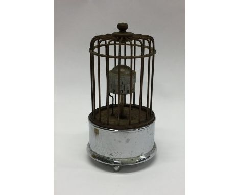 An unusual miniature alarm clock in the form of a bird cage. Est. £20 - £30.