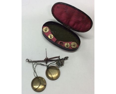 A Georgian cased miniature set of brass pan scales and weights, entitled, 'Justice' to lid. Est. £30 - £40.