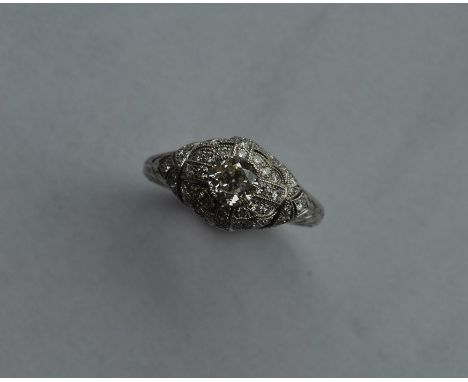 A good diamond and platinum mounted cocktail ring with large central stone in claw mount. Approx. 5.8 grams. Est. £1000 - £15