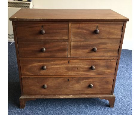 A Georgian mahogany two drawer and two door cupboard on shaped bracket feet. Est. £30 - £50.