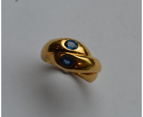 A French Antique sapphire mounted double head snake ring. Approx. 6 grams. Est. £650 - £750.