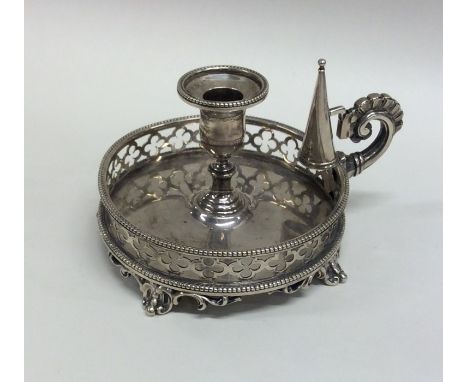 A good quality silver bachelor's chamber stick with pierced gallery and extinguisher. London. By GI. Approx. 206 grams. Est. 