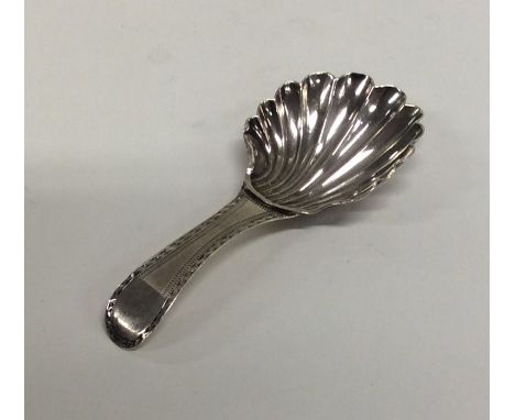 A Georgian silver bright cut caddy spoon with fluted bowl to bright cut handle. London. By Peter and Ann Bateman. Approx. 7 g