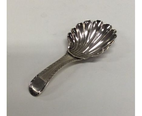 A Georgian silver bright cut caddy spoon with fluted bowl to bright cut handle. London. By Peter and Ann Bateman. Approx. 7 g