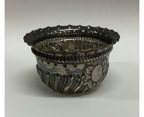 An Edwardian silver half fluted cream and sugar basin. London. By JS. Approx. 105 grams. Est. £30 - £40.