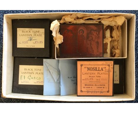A box containing old lantern slides. Est. £20 - £30.