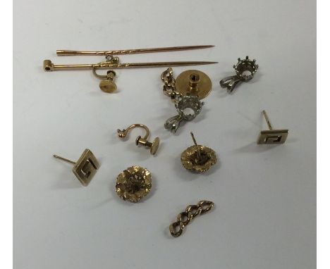 A pair of gold mounted earrings together with stick pins, pendants etc. Approx. 12 grams. Est. £80 - £120.