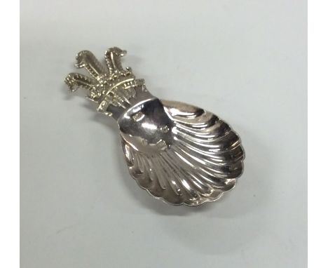 A modern cast silver caddy spoon decorated with 'The Prince of Wales' crest. London. Approx. 25 grams. Est. £30 - £50.