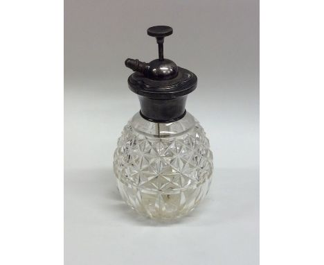 An engine turned silver mounted scent atomiser. Est. £15 - £20.