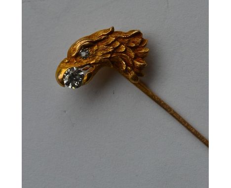 An Antique stick pin in the form of an eagle's head mounted with diamonds set in gold. Approx. 3.4 grams. Est. £500 - £800.