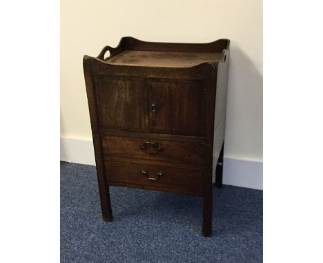A Georgian mahogany commode with hinged front. Est. £25 - £30.