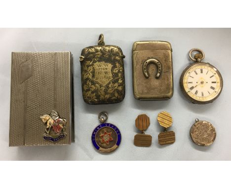 BAG CONTAINING TWO BASE METAL VESTA CASES, A SILVER DISC LOCKET, SILVER DOMINO LEAGUE MEDALLION, A 935 SILVER CASED FOB WATCH
