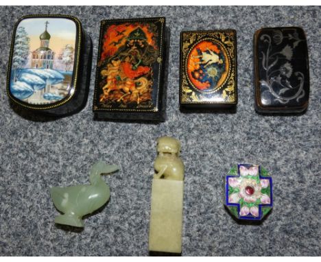 A selection of lacquered and enamel pill boxes together with a jade? duck and lion figure on plinth