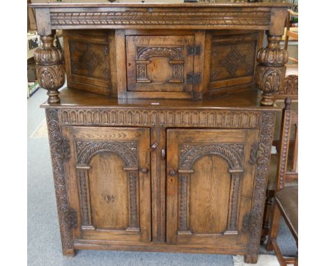 A Jacobean style oak carved buffet, 120 cm wide x 45 cm deep, 145 cm high