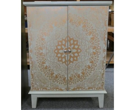 A small painted side cabinet with double doors and one shelf raised above floor level on four 16 cm legs, 68 cm wide x 33 cm 