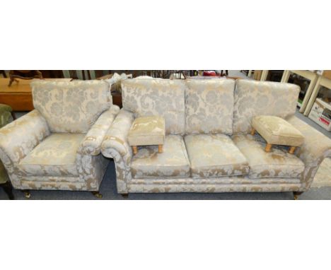 A modern three seater sofa together with a matching armchair in gold and teal floral fabric together with two stools (4)