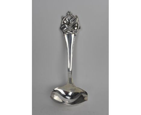 A mid 20th century Danish silver sauce ladle having a floral and pierced terminal, hallmarks for Denmark 1956 and makers mark