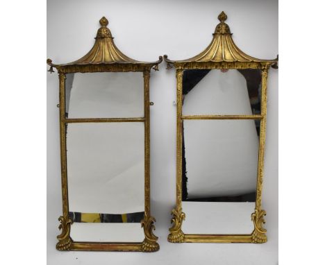 A pair of early 20th century Chinese Chippendale style gilt framed mirrors with pagoda tops, chamfered, reeded, floral uprigh