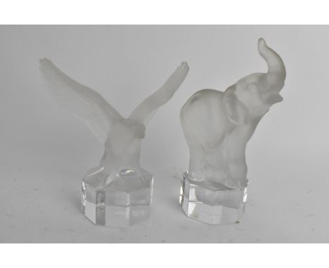 Two Goebel frosted glass paperweights raised on octagonal formed bases to include one in the form of an elephant 13.4 cm high
