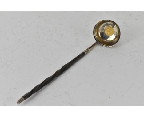 A Victorian silver toddy ladle by Chawner &amp; Co, London 1859, the bowl set with an American gold $1 coin 1856, on a whale 
