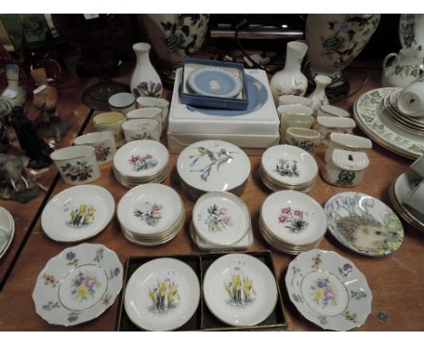 A large collection of Royal Worcester pin dishes, Jasperware